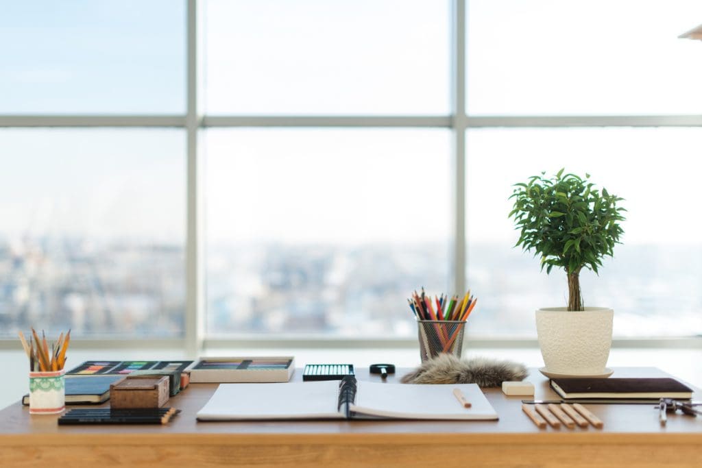 artist-workplace-ready-for-pastel-drawing-colorful-pencils-and-crayons-palette-organized-on-the-desktop