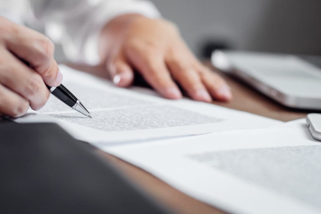 insurance-agent-checking-policy-documents-in-office