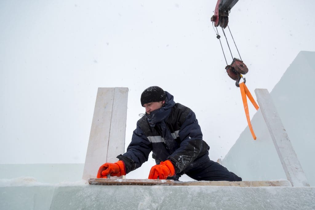 assembler-at-the-construction-site-with-a-brush-in-his-hands